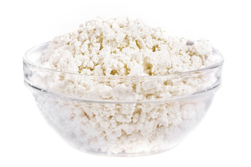 Fresh cottage cheese (curd) in glass bow, isolated on white back
