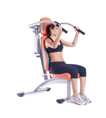 Brunette woman sitting on exerciser isolated