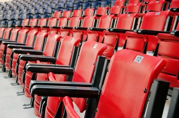 Fototapeta premium Conference room full of blue and red seats
