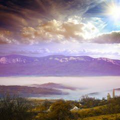 mountians village under fog