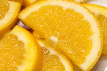 Fotobehang Plakjes fruit gesneden sinaasappel