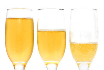 three glasses of champagne on a white background
