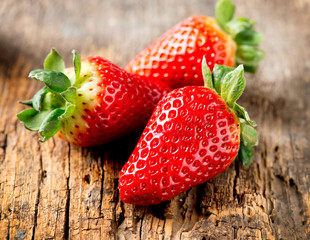 Strawberry over Wooden Background. Strawberries close-up