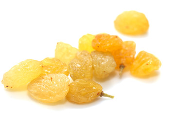 Fototapeta na wymiar yellow raisins on a white background. macro