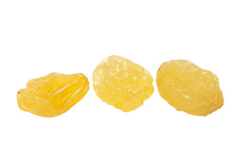 yellow raisins on a white background. macro