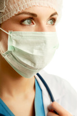 A portrait of a female doctor in uniform , isolated on white