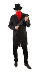 Criminal masked with red scarf with shotgun