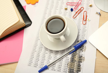 Cup of coffee on office desktop close-up