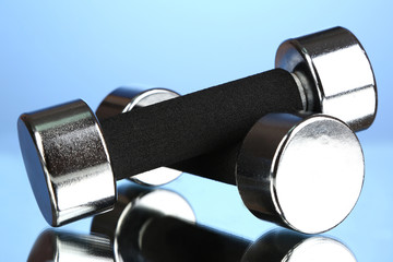 Dumbbells at 2 kg on blue background