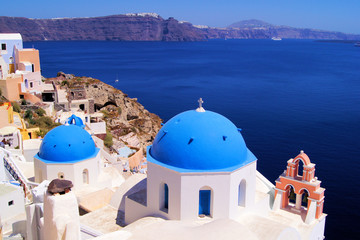 Naklejka premium Famous blue dome churches of Santorini, Greece