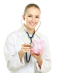 A doctor listening piggy box with a stethoscope, close-up