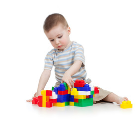 baby boy playing with block toy over white background