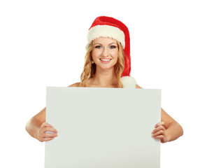 Beautiful christmas woman in santa hat holding