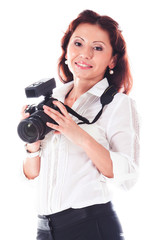 Fototapeta premium Young and beautiful woman with a professional camera in hand