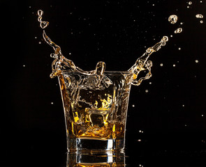 Image of  Glass of whiskey with splash, isolated on black background printed on Printed Glass Basin Splashbacks