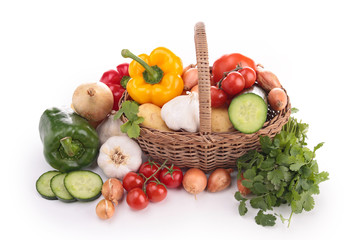 isolated wicker basket with vegetables
