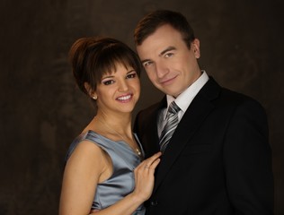 Happy elegant couple in classic dress