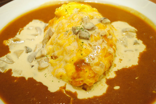 steamed rice topped with omelet and curry soup