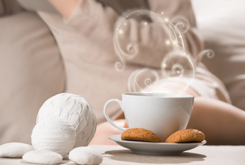 Cup of hot beverage tea or coffee with oat cookies and a lot of