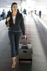 Businesswoman at the airport looking to the side