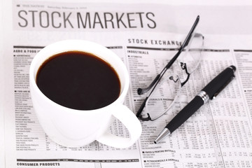 Fresh hot coffee on newspaper