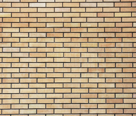 Yellow brick wall.The facade view of yellow brick wall.
