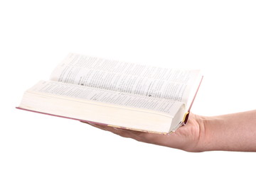 Praying hand hold an open bible
