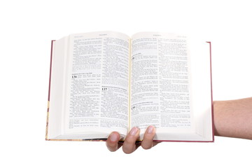 Fototapeta premium Praying hand hold an open bible