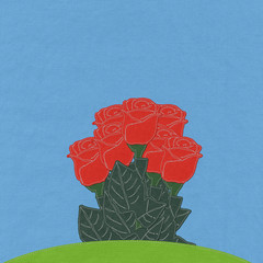 Red rose on green grass field with stitch style fabric backgroun