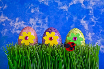 EASTER EGGS ON GREEN GRASS