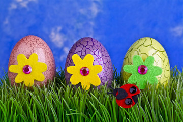 EASTER EGGS ON GREEN GRASS