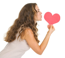 Young woman kissing valentine's day cards