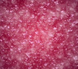 Hearts and particles on a pink background