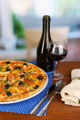 Tasty pizza with wine