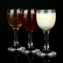 Tasty color liquors, isolated on black