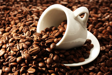 Cup with coffee beans, close up