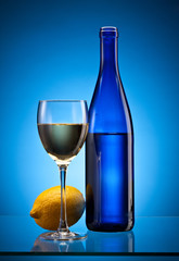 blue wine bottle and lemon