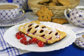 Cake with cranberries on decorated table