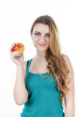 Beautiful girl with apple versus chocolate on white background