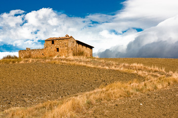 Farmhouse on hill in Tuscany Italy