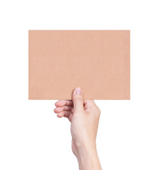Fototapeta premium Female hand holding empty piece of cardboard isolated on white