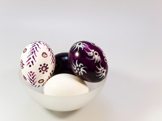 Painted easter eggs in glass bowl