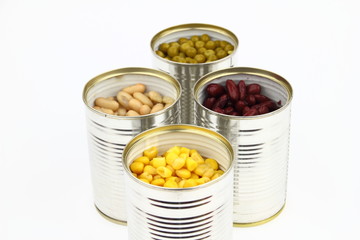 The tins with peas, bean, red bean, corn on the white background