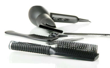 Color comb brushes, hairdryer isolated on white