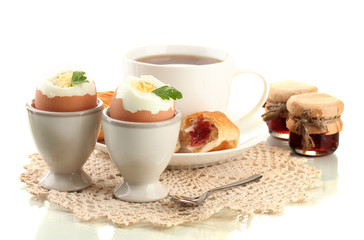 Light breakfast with boiled eggs and coffee, isolated on white
