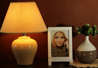 White photo frame and lamp