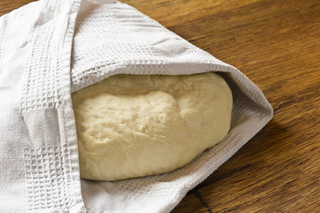 raw dough on a wooden table