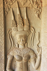 Fototapeta premium Wall bas-relief of Devata, Angkor Wat temple, Cambodia