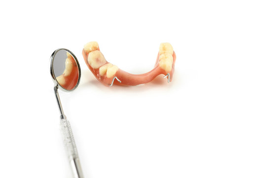 Partial denture reflected in dental mirror