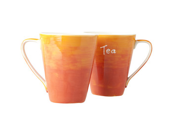 Two colorful porcelain mugs on white background